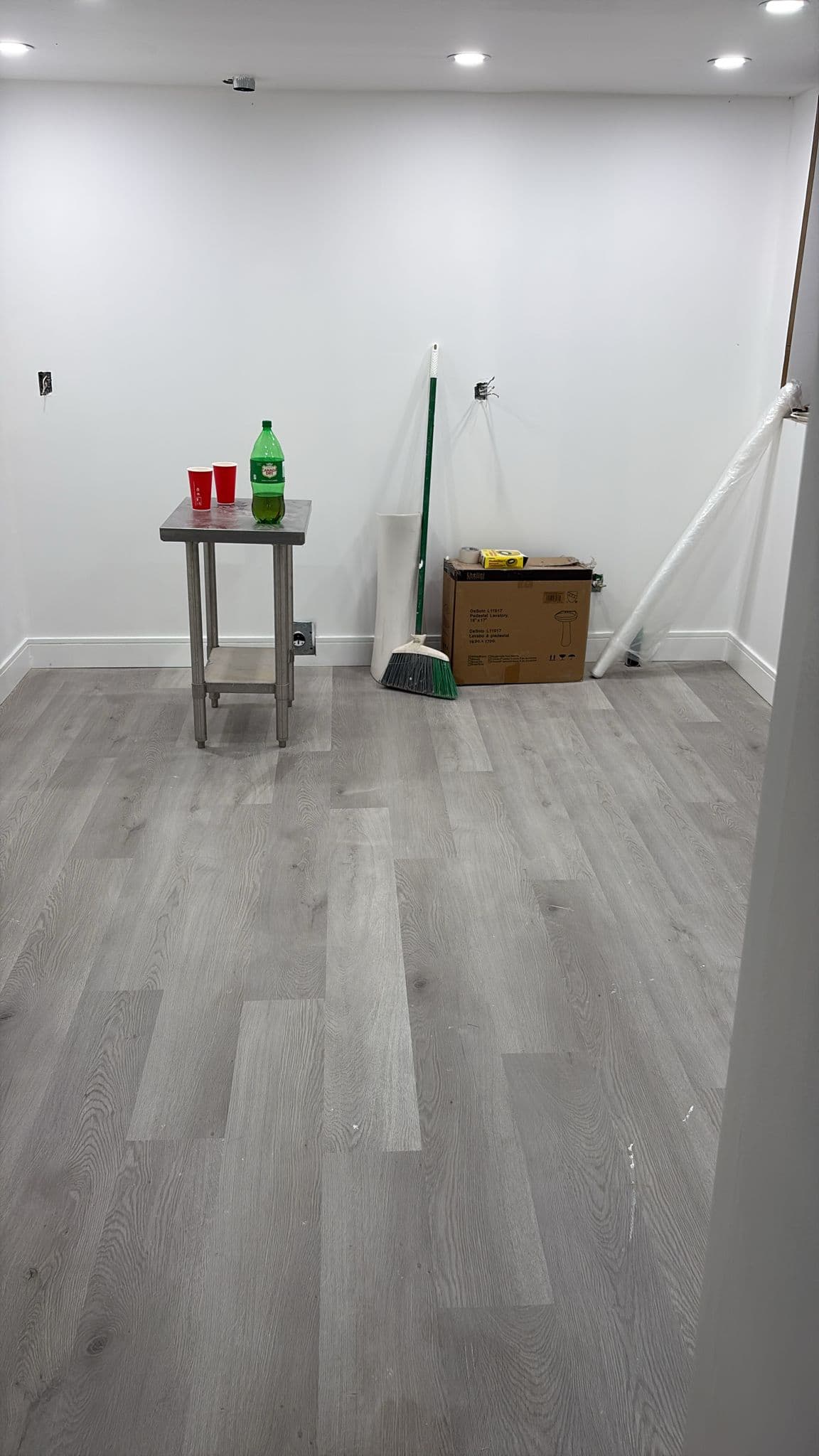 Finished interior with new floors, trim, and lighting